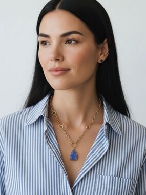 Goldtone Double Chain Necklace with a Blue Glass Pendant by Plunder Design